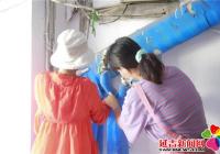 化身樓道“美容師” 法院志愿者活躍在創城第一線